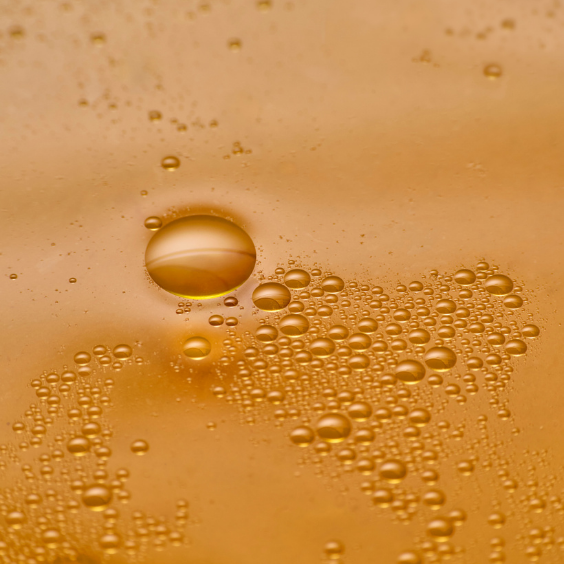 yellow orange apple cider vinegar with bubbles