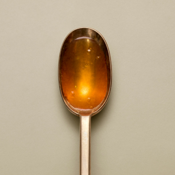 silver spoon of apple cider vinegar used in besto nut free pesto
