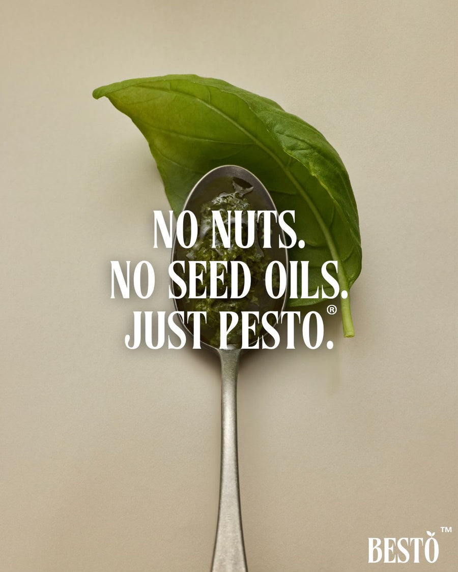 Spoonful of Bestō pesto with a basil leaf: No nuts. No seed oils. Just pesto.