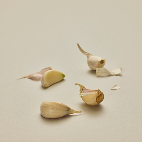 Garlic bulbs on a beige background